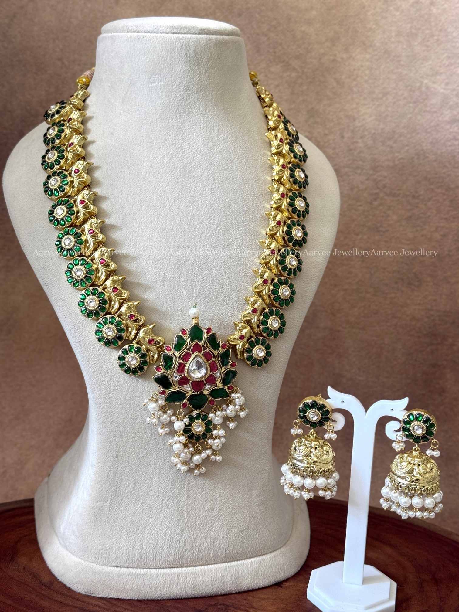 JADAU KUNDAN GREEN STONES BUTTA HARAM SET WITH LOTUS PENDANT