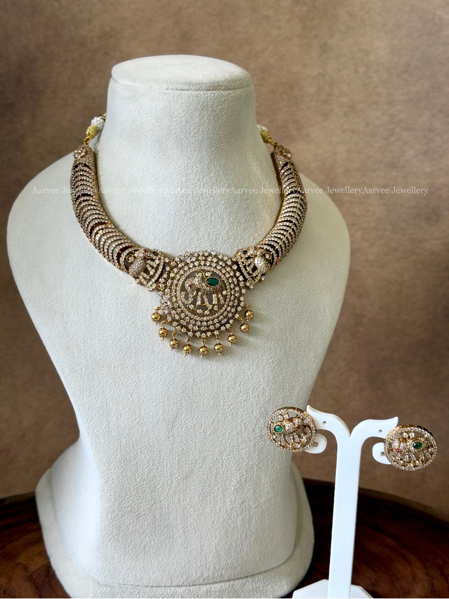 WHITE CZ STONE NECKLACE SET WITH ELEPHANT PENDANT AN GOLD BEADS