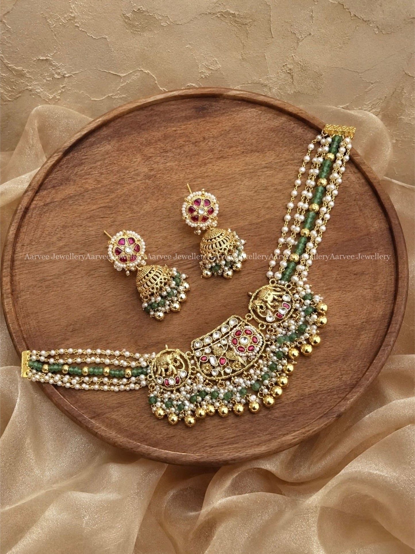 POLKI KUNDAN GOLD FINISH ELEPHANT MOTIF PEARL AND PASTEL BEAD CHOKER SET