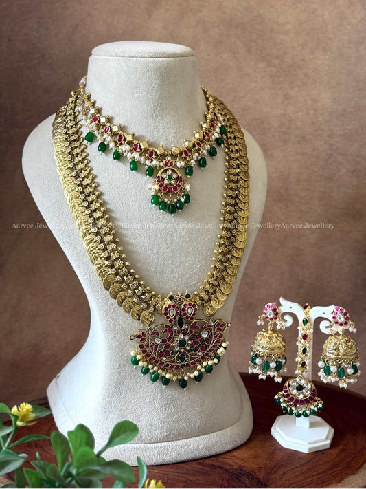 AN EXCLUSIVE JADAU KUNDAN BRIDAL JEWELLERY WITH COIN DESIGN AND GREEN BEADS