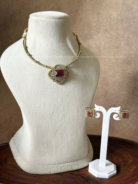 GOLD TONE KANTI NECKLACE SET WITH RED STONE CZ PENDANT