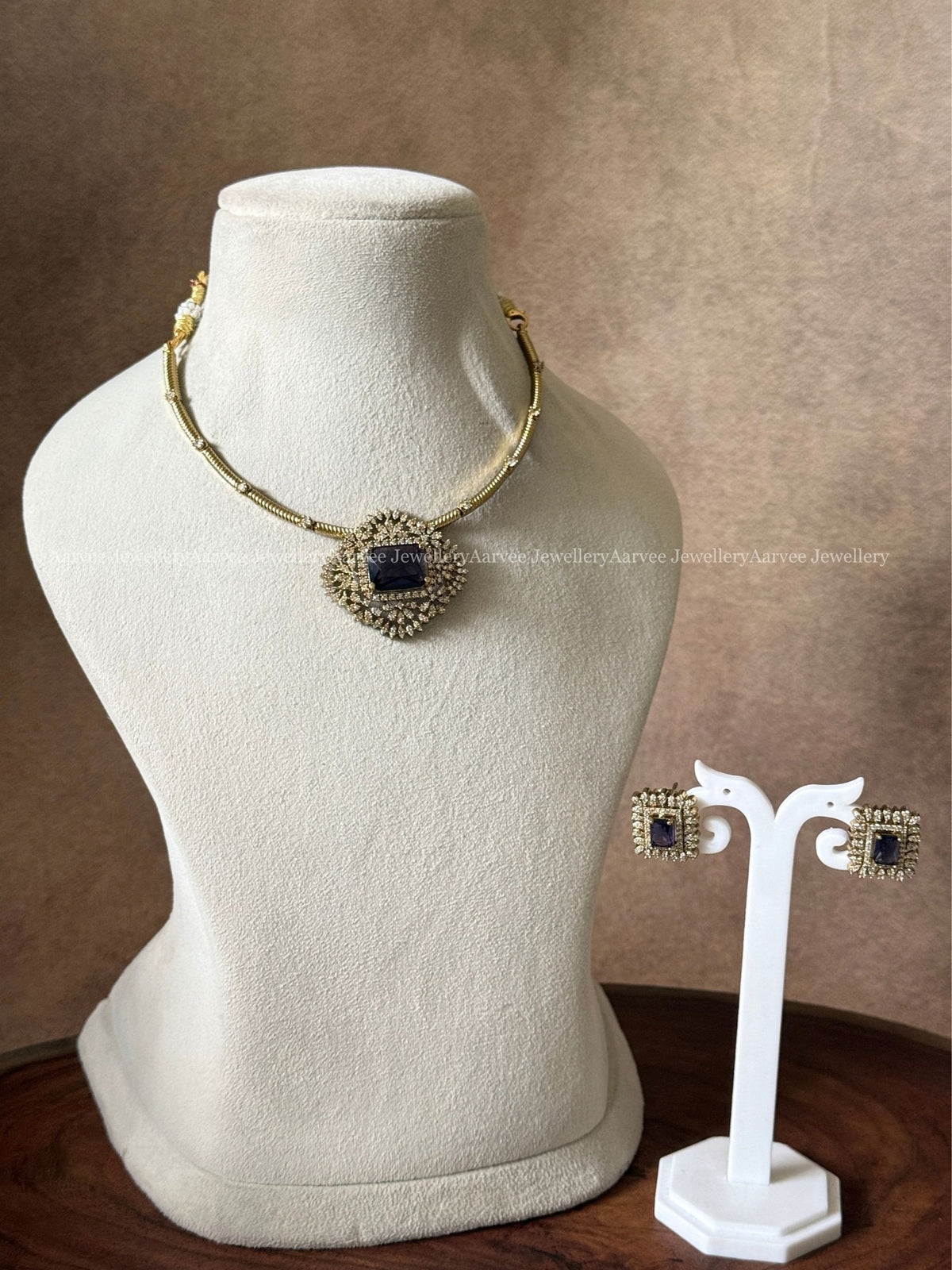 GOLD TONE KANTI NECKLACE SET WITH PURPLE STONE CZ PENDANT