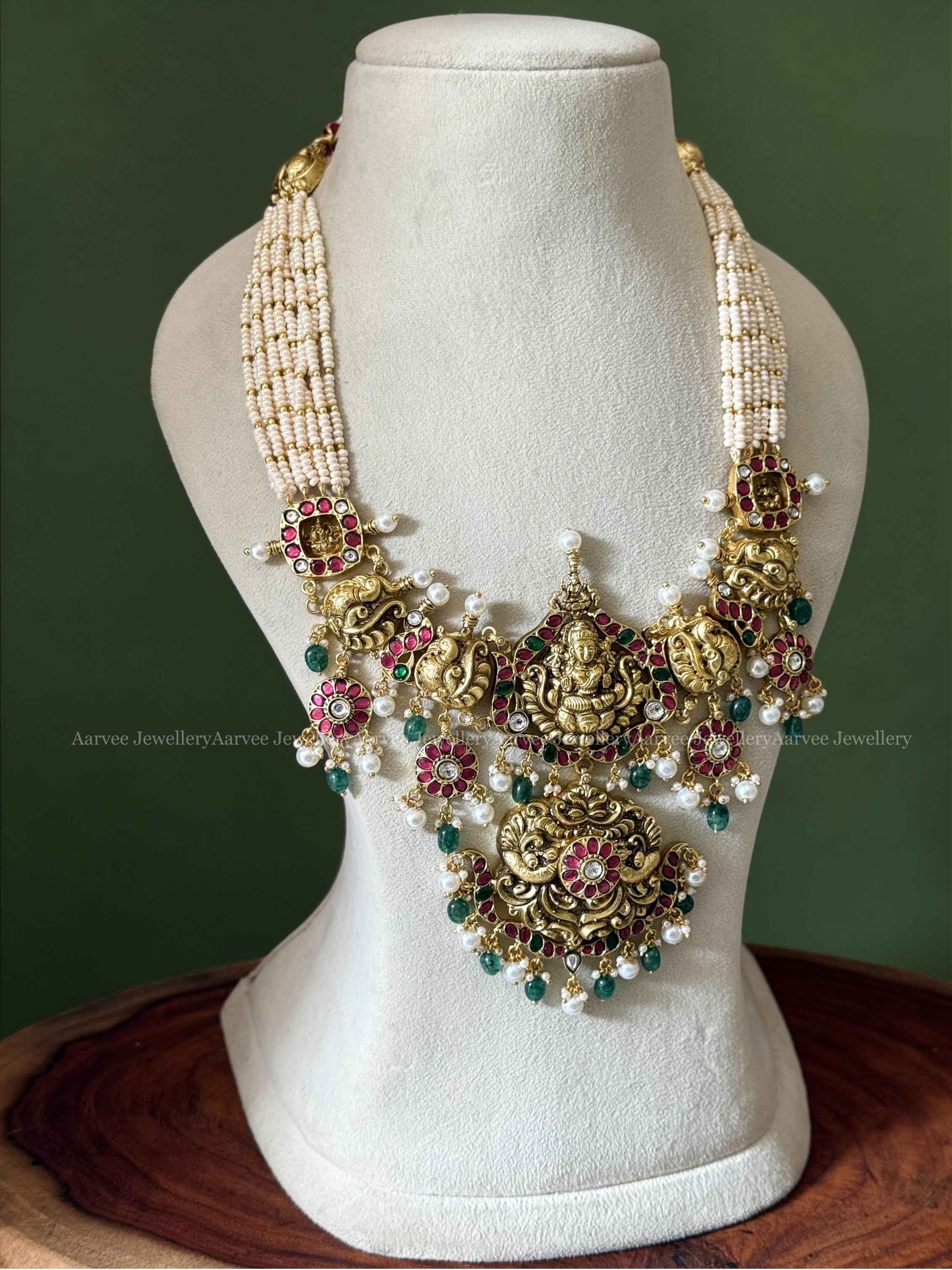 JADAU KUNDAN PEARL BUNCH MIDLENGTH NECKLACE WITH LAXMI PENDANT AND GREEN BEADS