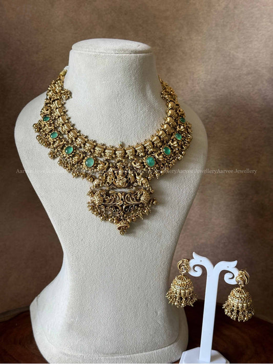 PREMIUM GOLD TONE LAKSHMI NECKLACE SET WITH PASTEL GREEN STONES