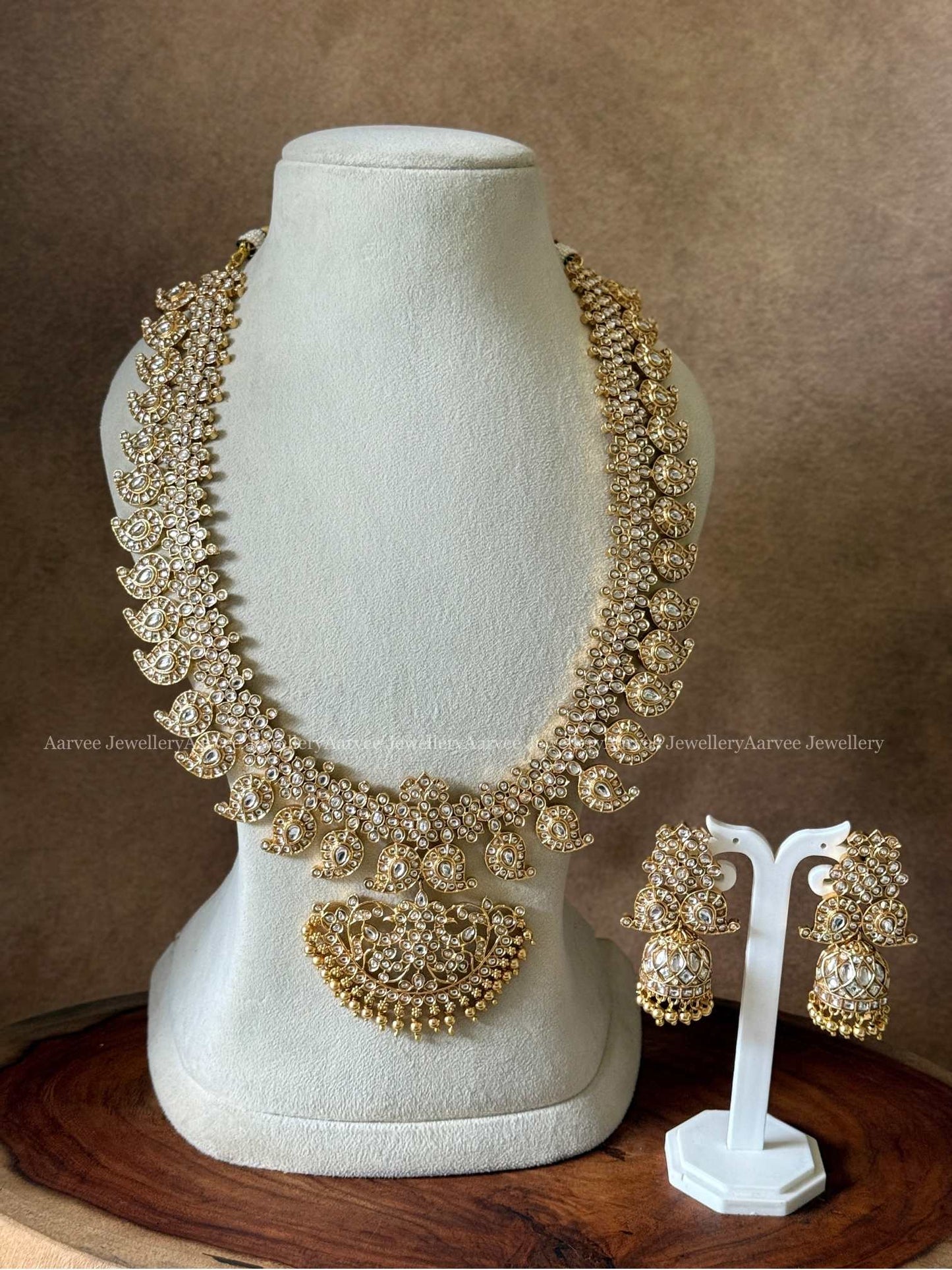 A CLASSIC MANGO MOTIF HARAM SET WITH KUNDAN WHITE STONES