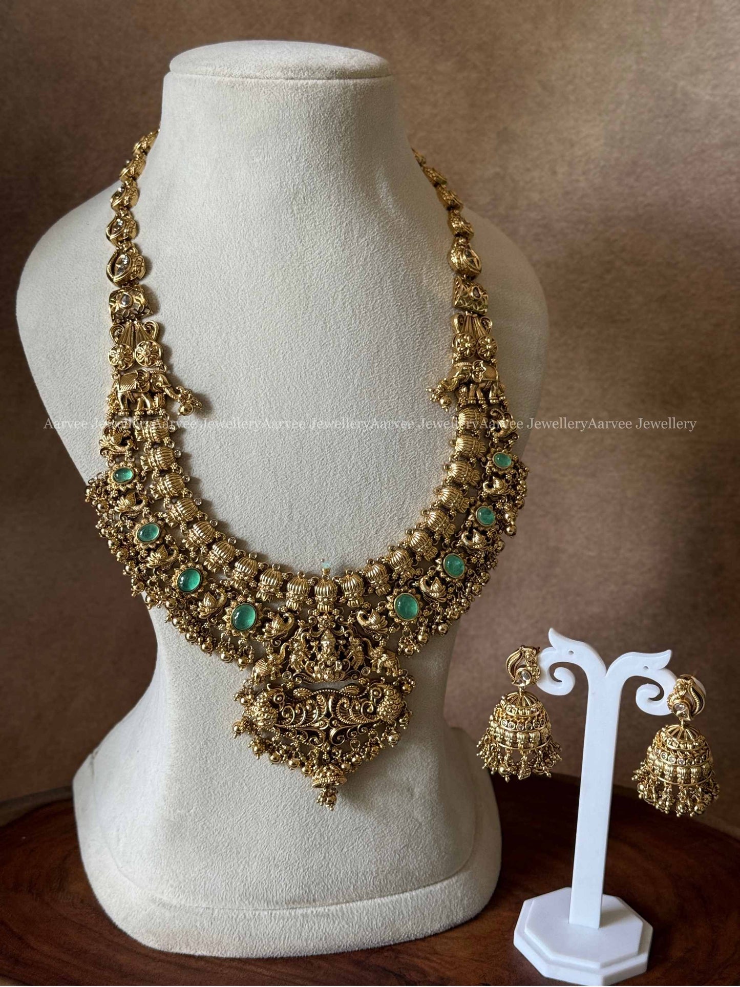 PREMIUM GOLD TONE LAKSHMI HARAM SET WITH PASTEL GREEN STONES