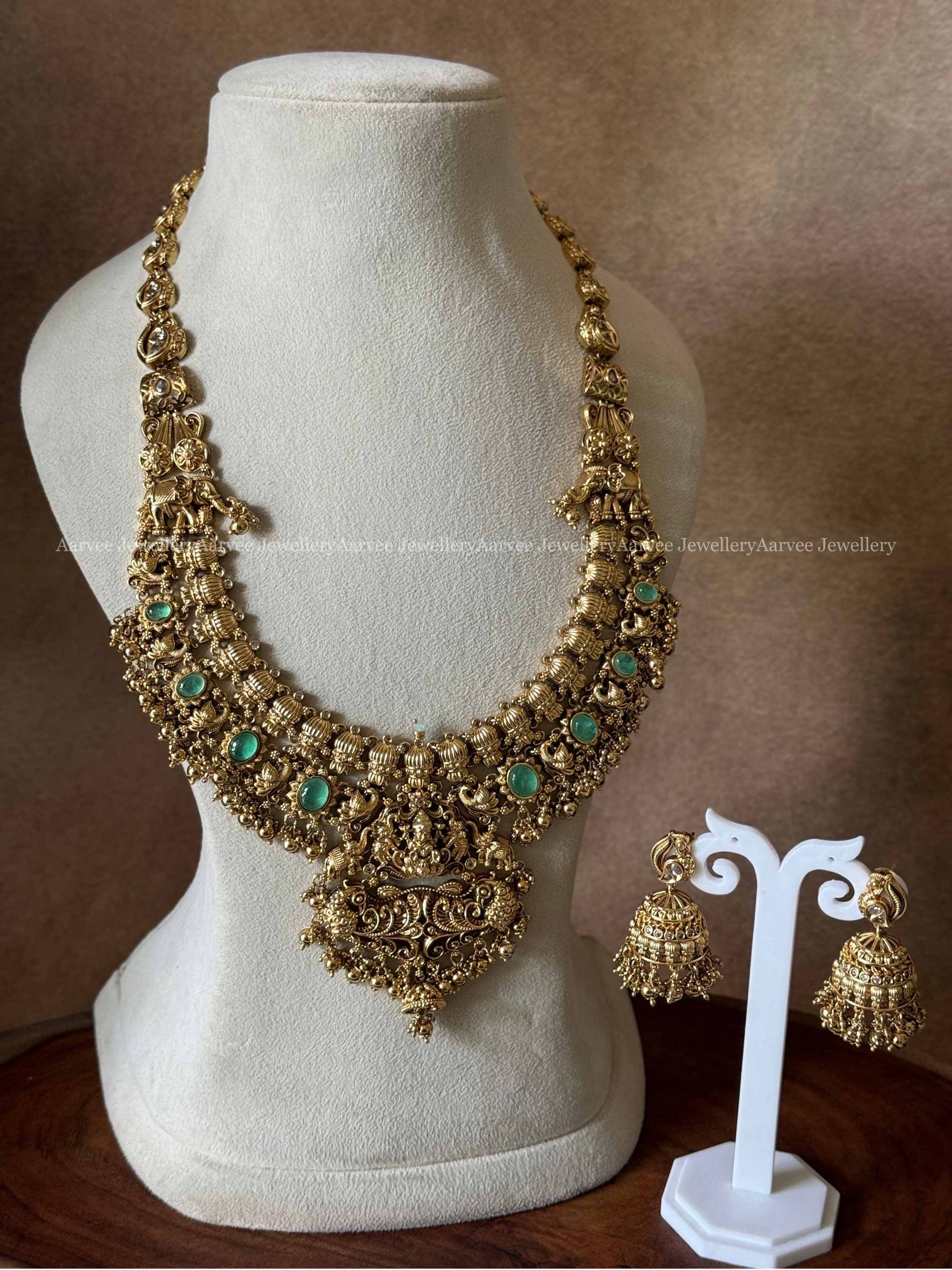 PREMIUM GOLD TONE LAKSHMI HARAM SET WITH PASTEL GREEN STONES