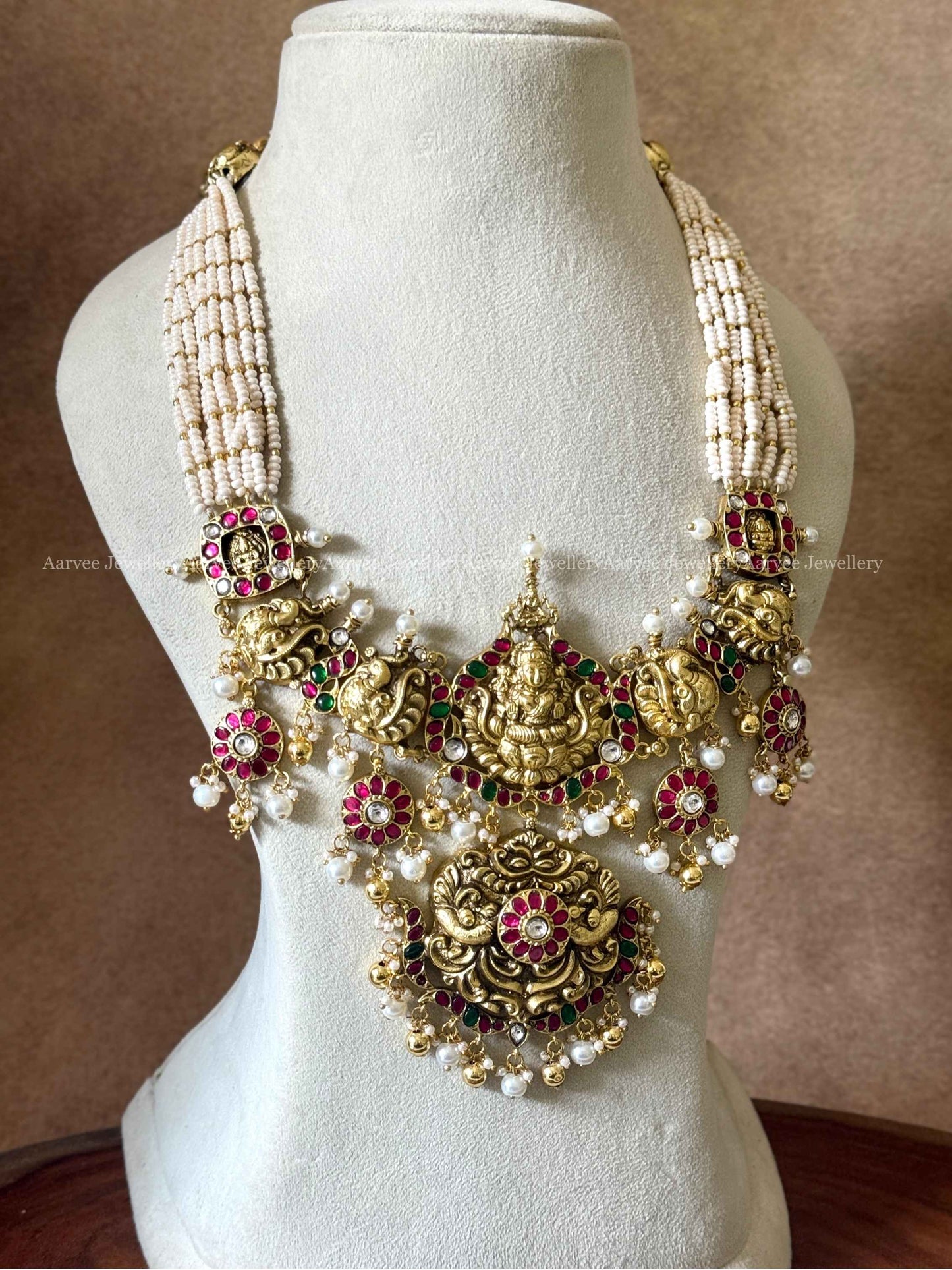 JADAU KUNDAN PEARL BUNCH MID LENGTH LAXMI PENDANT HARAM WITH PEARL AND GOLD BEADS