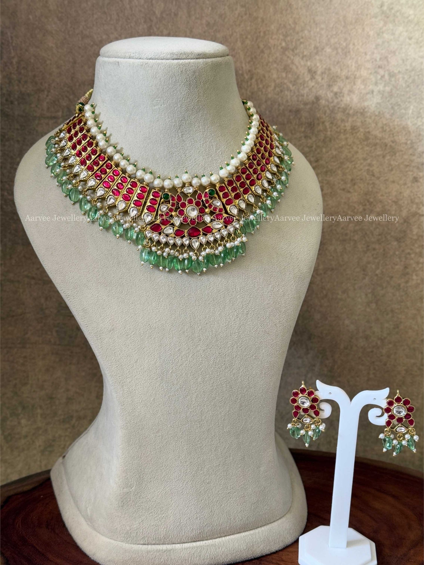 JADAU KUNDAN RUBY STONE NECKLACE SET WITH PEACOCK DESIGN AND PASTEL GREEN BEADS