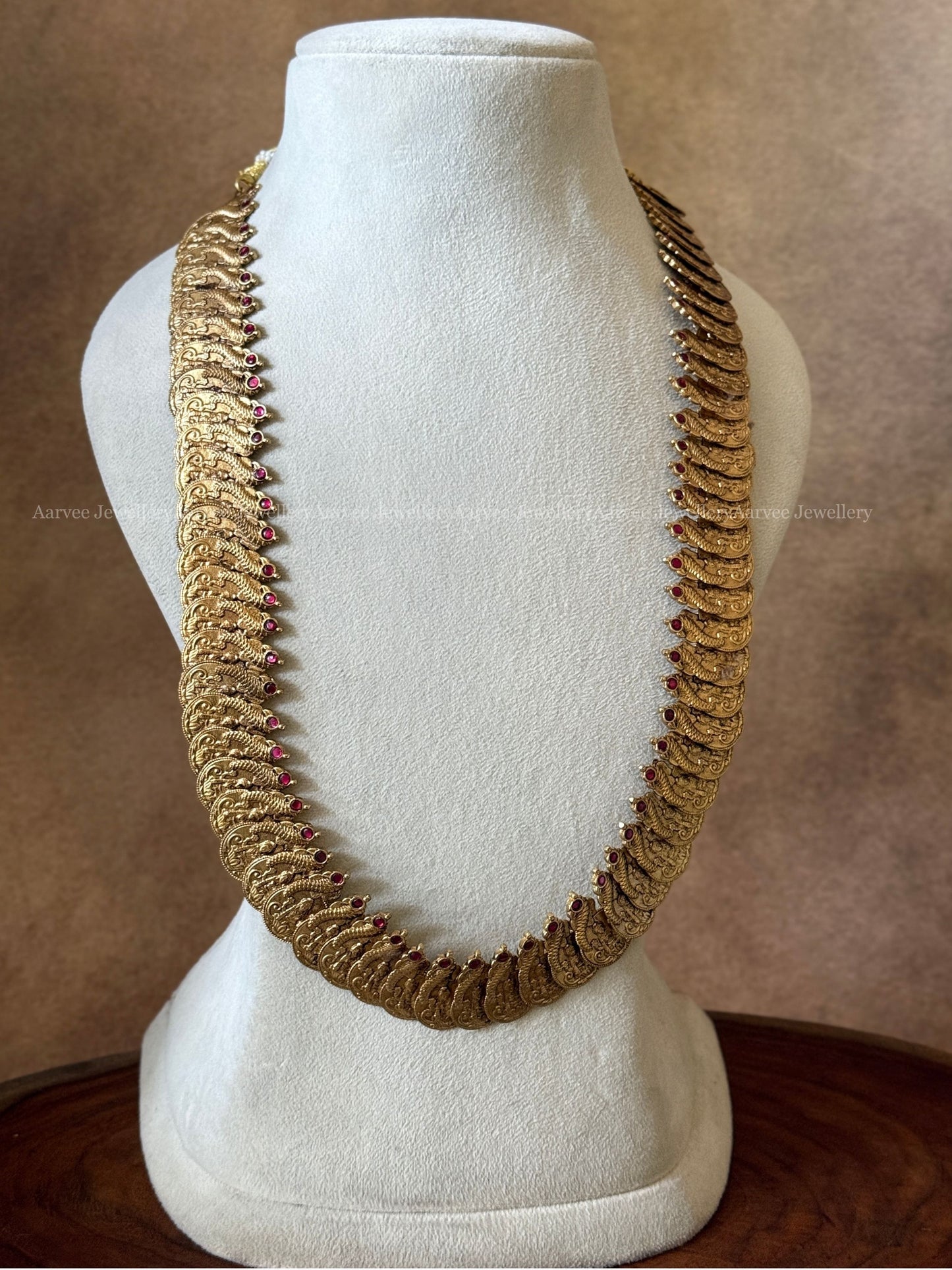 JADAU KUNDAN RUBY STONE CRESCENT AND FLORAL NECKLACE WITH PEACOCK MOTIF COIN HARAM