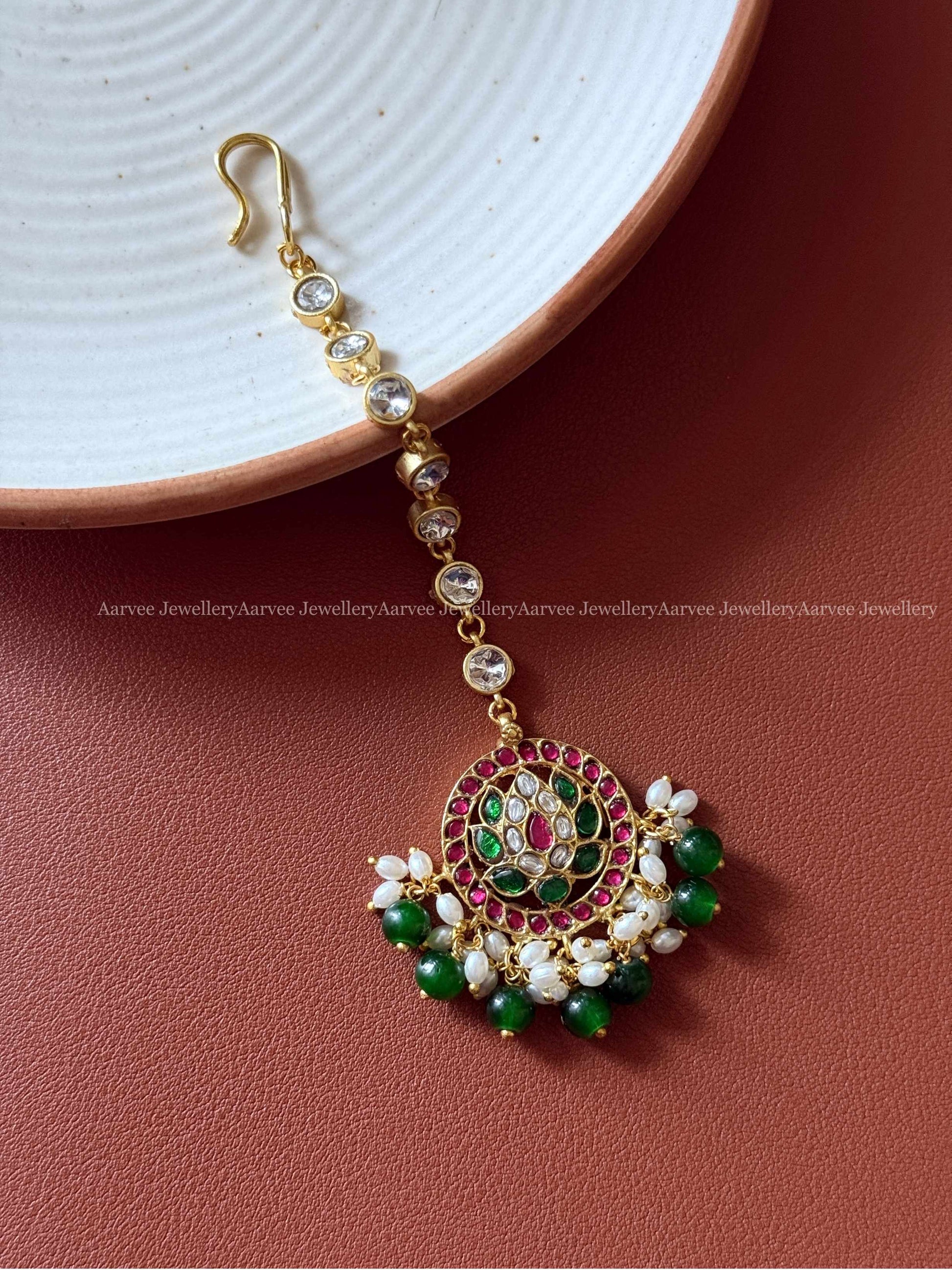 JADAU KUNDAN MULTI COLOR LOTUS TIKKA WITH GREEN BEADS