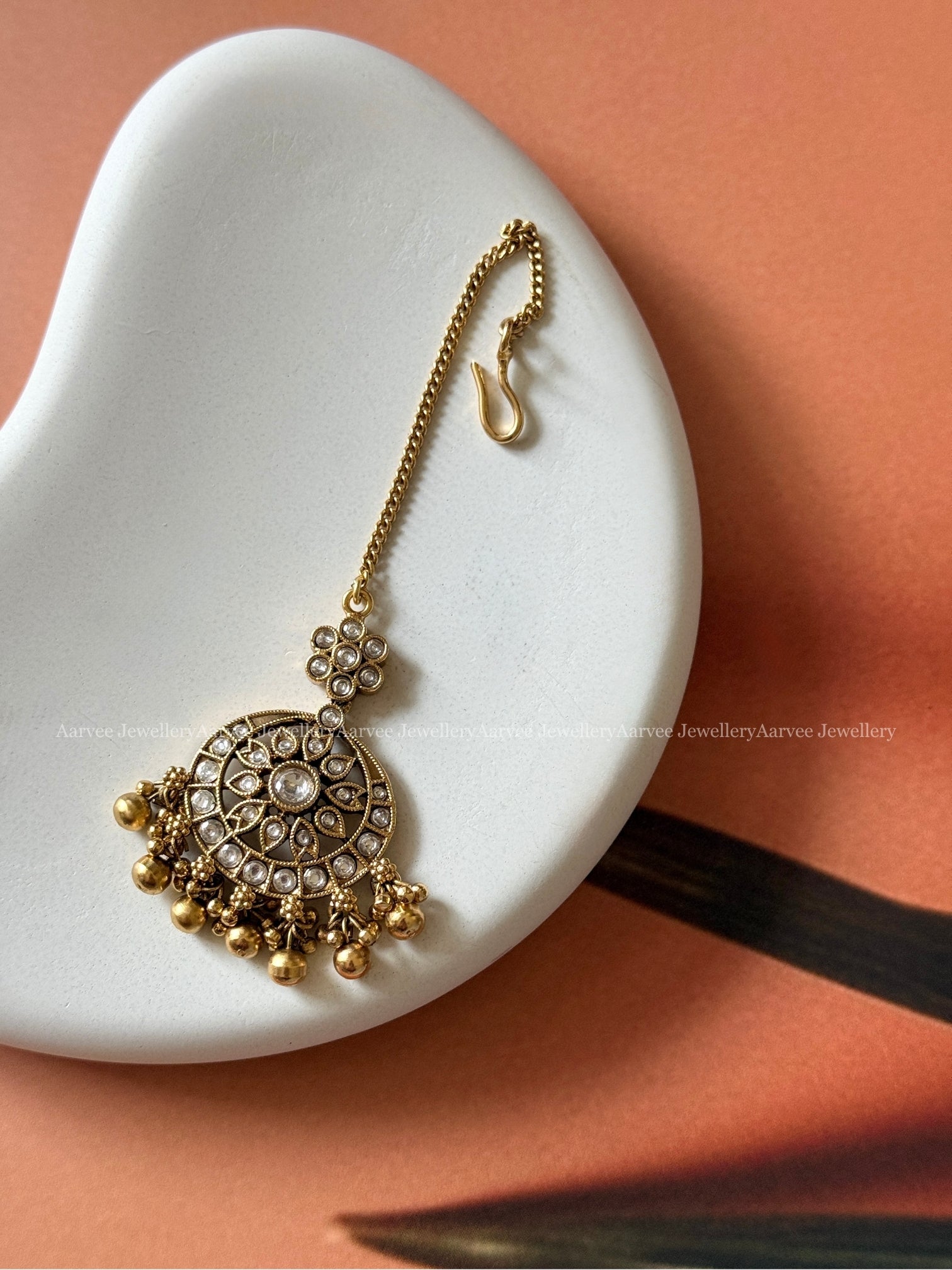 WHITE STONE FLORAL TIKKA WITH GOLD BEADS