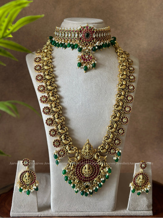 KEMP CHOKER PAIRED WITH NAGAS/ NAKSHI MOTIF HARAM WITH RUBY STONES & GREEN BEADS