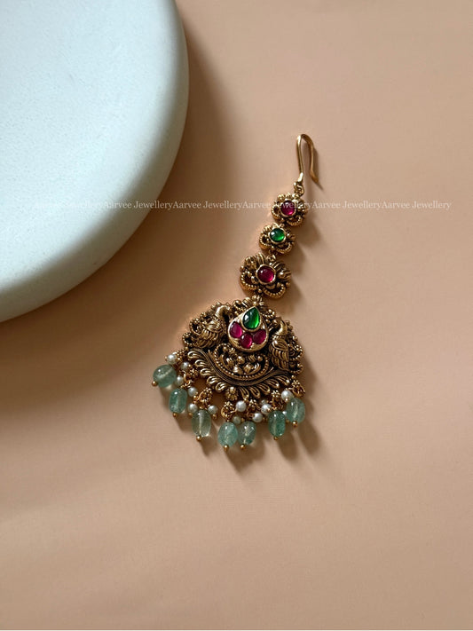ANTIQUE GOLD PEACOCK MOTIF TIKKA WITH PASTEL BEADS