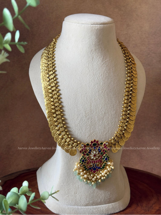 JADAU KUNDAN MID LENGTH GOLD COIN CHAIN WITH PEACOCK& FLORAL PENDANT IN RUBY & BLUE STONES AND PASTEL BEADS