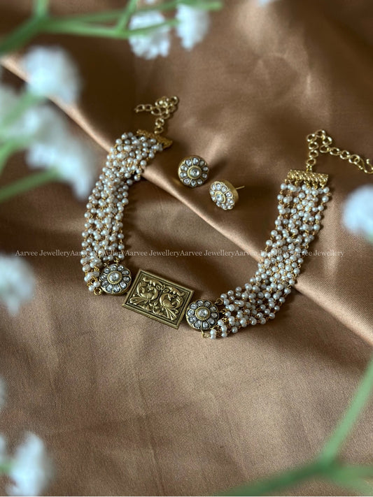 JADAU KUNDAN MULTI LAYER  PEARL BUNCH CHOKER WITH PEACOCK EMBOSSED PENDANT