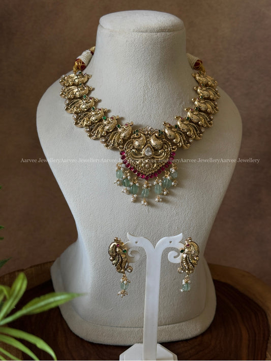 MILD ANTIQUE GOLD PEACOCK DESIGN NECKLACE SET WITH PASTEL BEADS