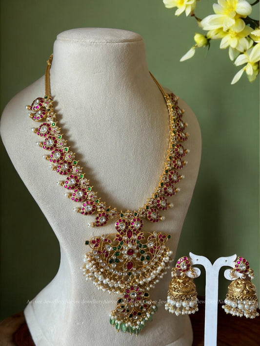 JADAU KUNDAN MID LENGHTH MANGO MOTIF HARAM SET WITH PEACOCOK PENDANT AND PASTEL BEADS