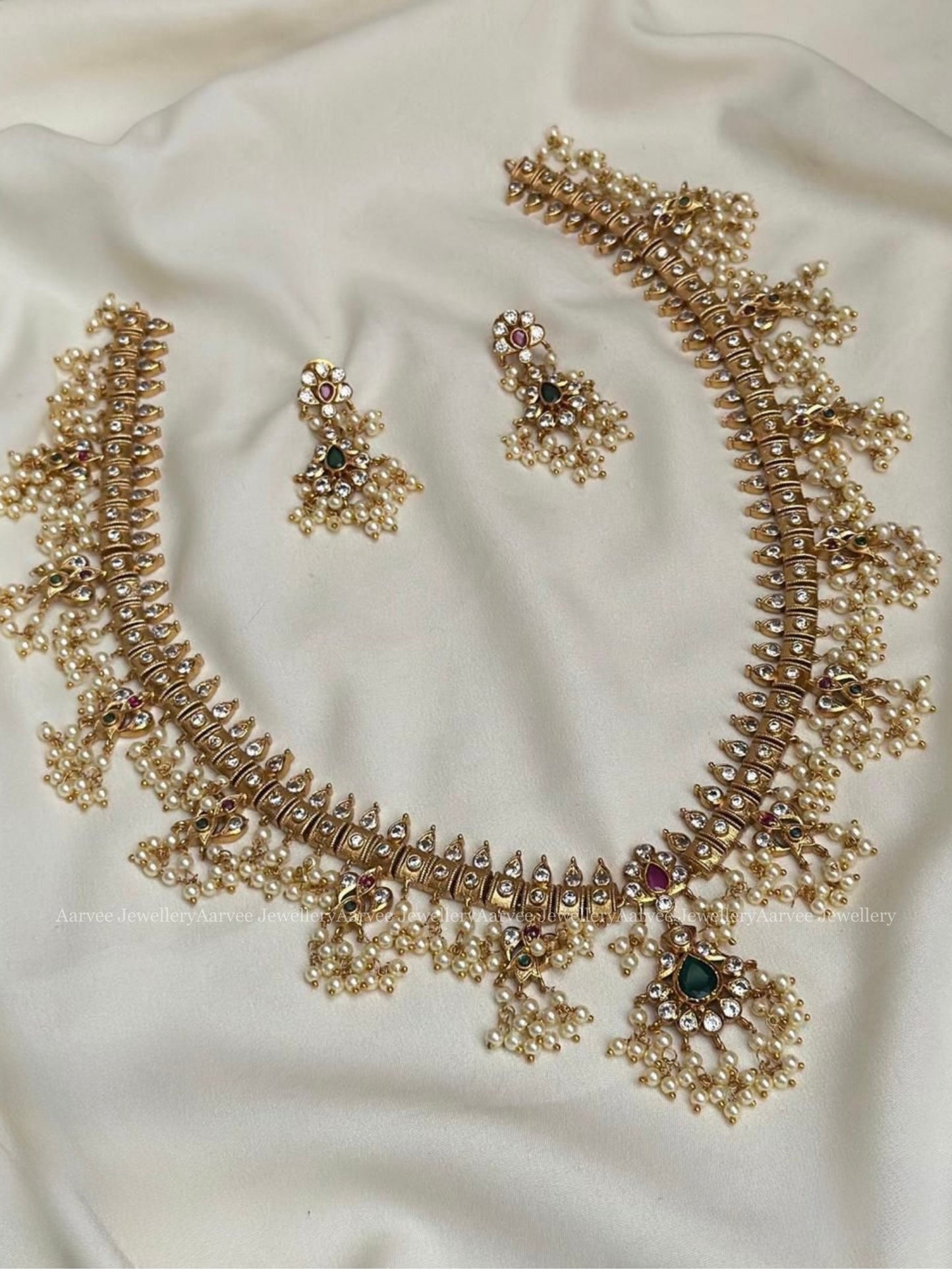 CLASSIC GOLD FINISH GUTTA PUSALU HARAM SET WITH PEARLS