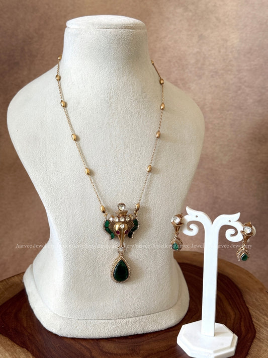 GOLD MID LENGTH CHAIN SET WITH ELEPHANT PENDANT IN GREEN STONES