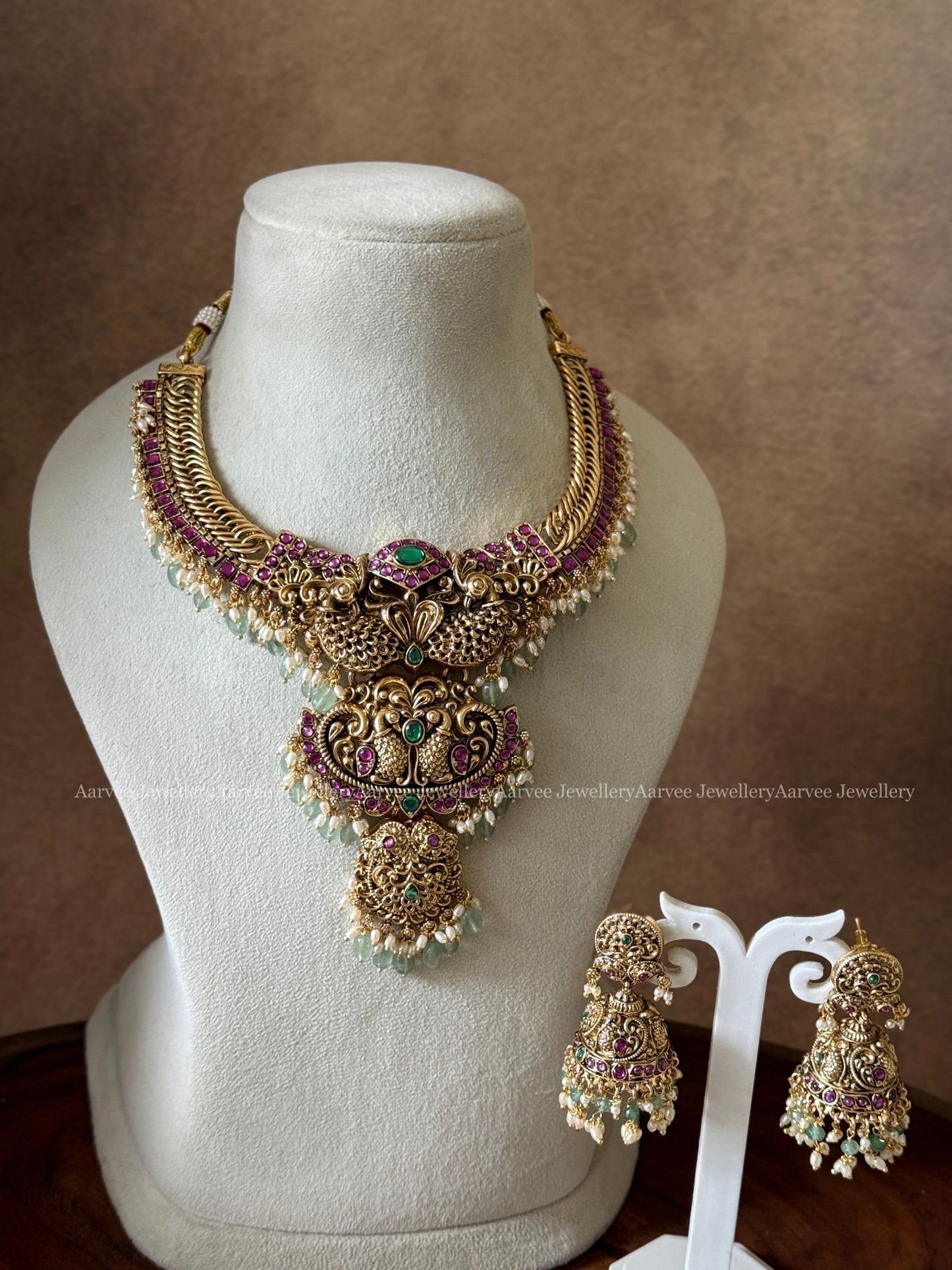 PREMIUM ANTIQUE GOLD JALEBI NECKLACE SET WITH PEACOCK MOTIF AND PASTEL BEADS