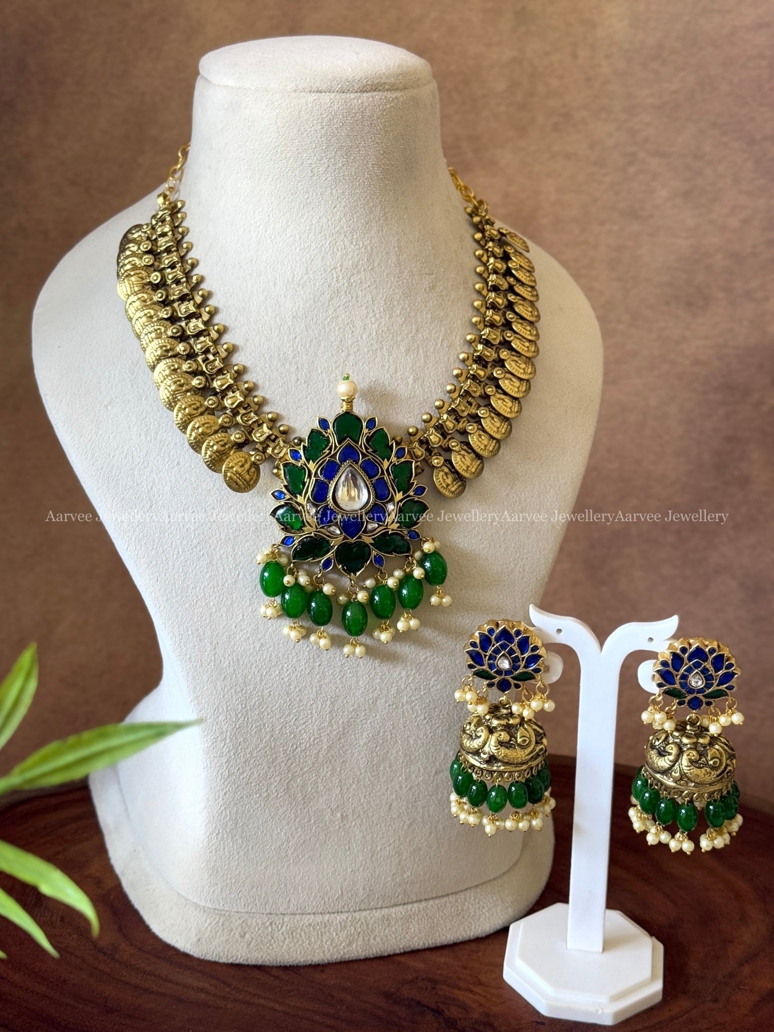 JADAU KUNDAN COIN NECKLACE SET WITH BLUE STONE LOTUS PENDANT AND GREEN BEADS