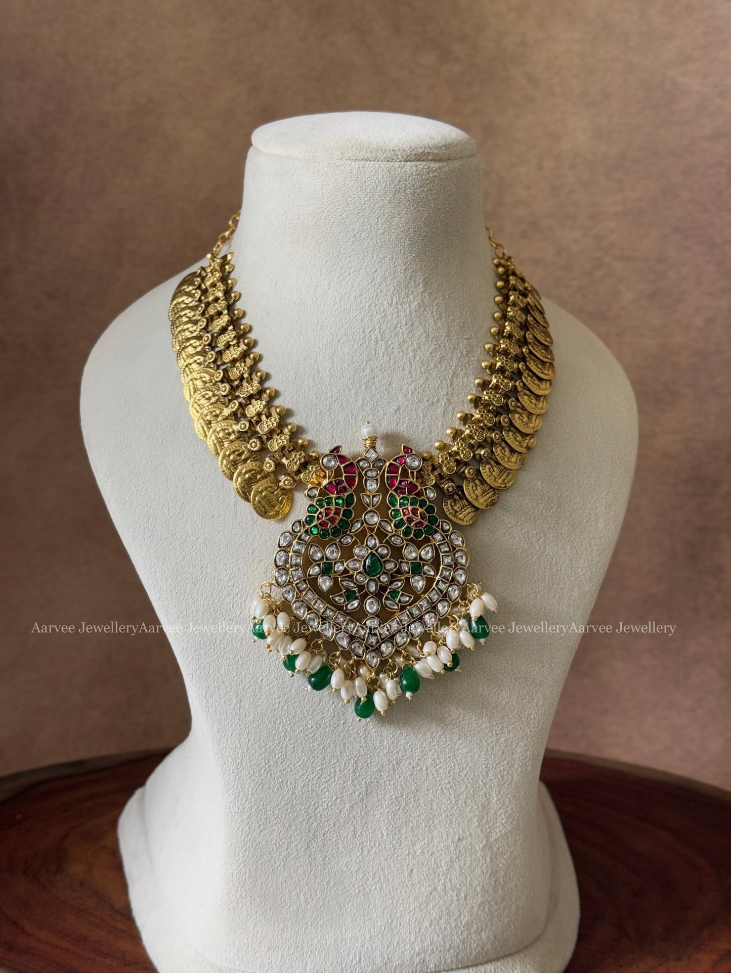 JADAU KUNDAN COIN NECKLACE WITH WHITE STONE PEACOCK PENDANT AND MIX OF GREEN & PEARL BEADS
