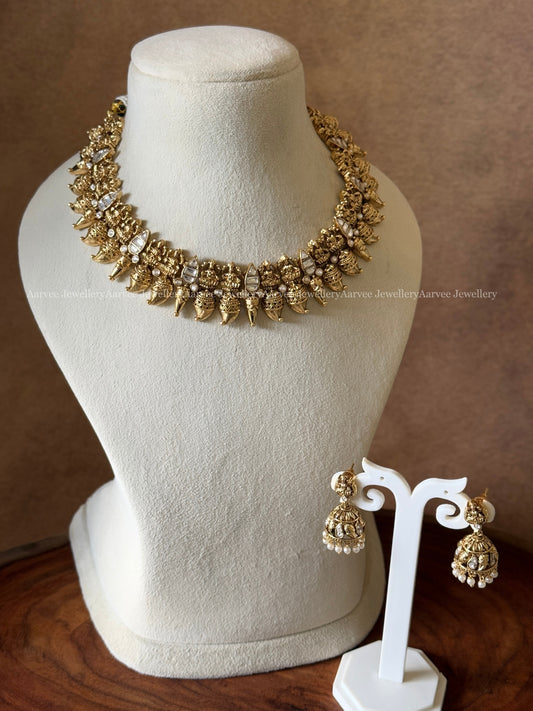 ANTIQUE GOLD TONE LAKSHMI AND WHITE STONE NECKLACE SET