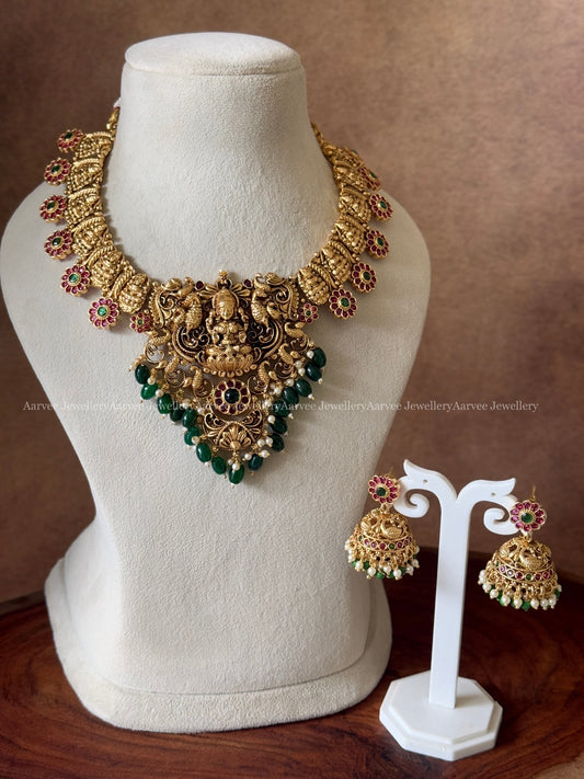 GOLD FINISH LAKSHMI NECKLACE SET WITH GREEN BEADS