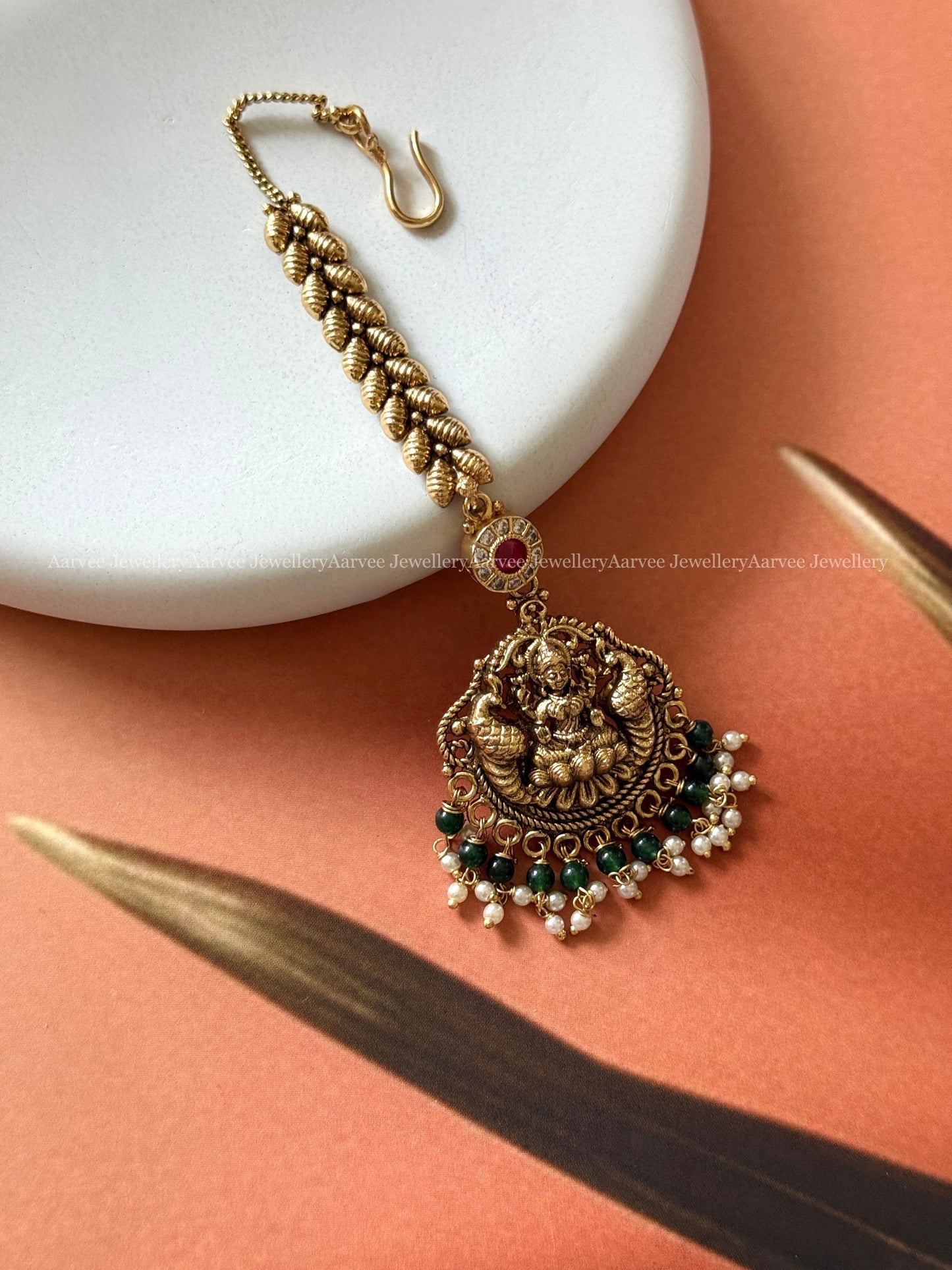 ANTIQUE GOLD LAKSHMI TIKKA WITH GREEN BEADS & PEARLS