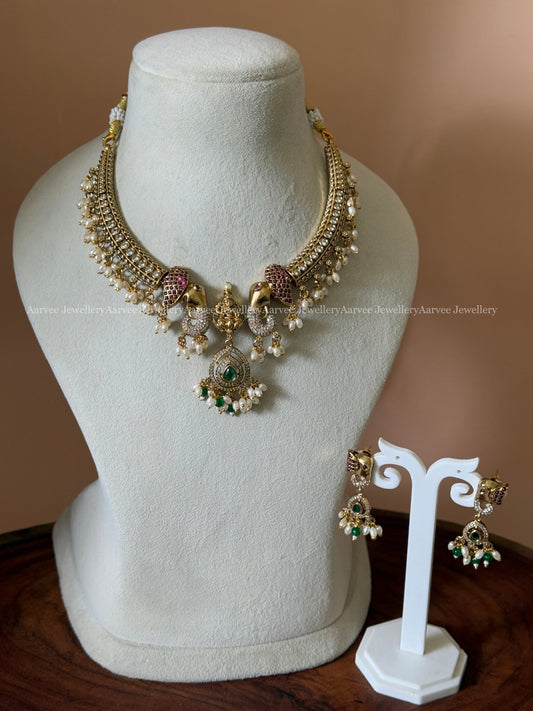 CZ STONES KANTI NECKLACE SET WITH ELEPHANT & LAKSHMI PENDANT WITH PEARLS AND TINY GREEN BEADS