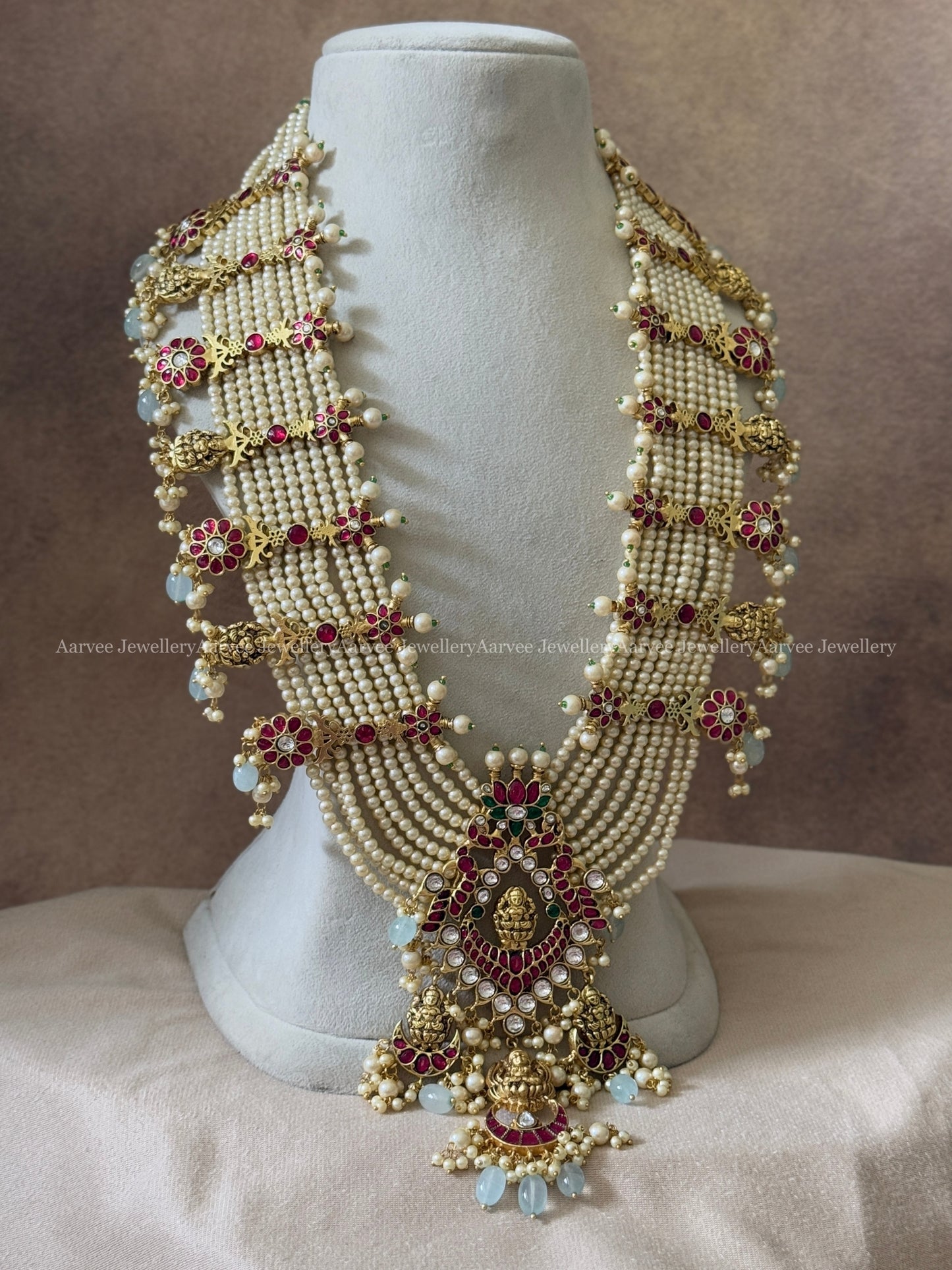 JADAU KUNDAN BRIDAL STATEMENT MULTI LAYERED PEARL HARAM WITH LAKSHMI PENDANT AND PASTEL BEADS