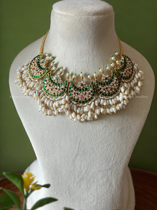 JADAU KUNDAN FIVE PENDANT CHAAND DESIGN NECKLACE IN GREEN STONES AND RICE PEARLS DROPPINGS