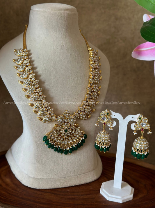 JADAU KUNDAN : FULL WHITE STONES MANGO NECKLACE WITH PEACOK JHUMKI IN DARK GREEN  BEADS