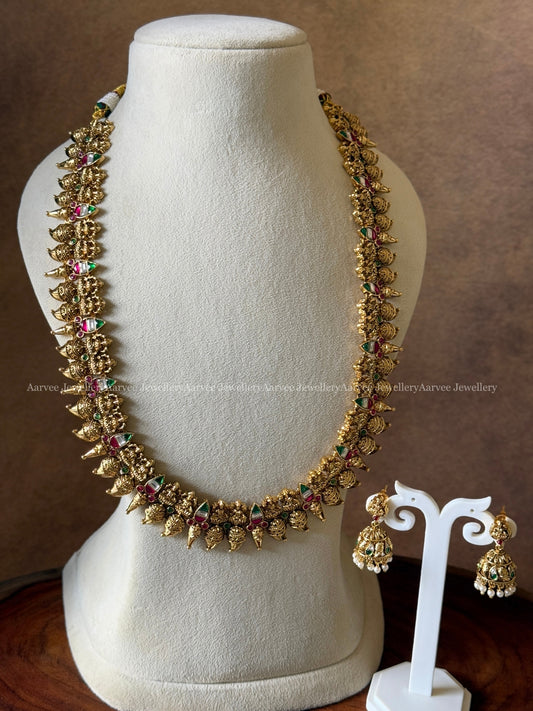 ANTIQUE GOLD TONE LAKSHMI AND MULTI COLOR KEMP STONES HARAM SET