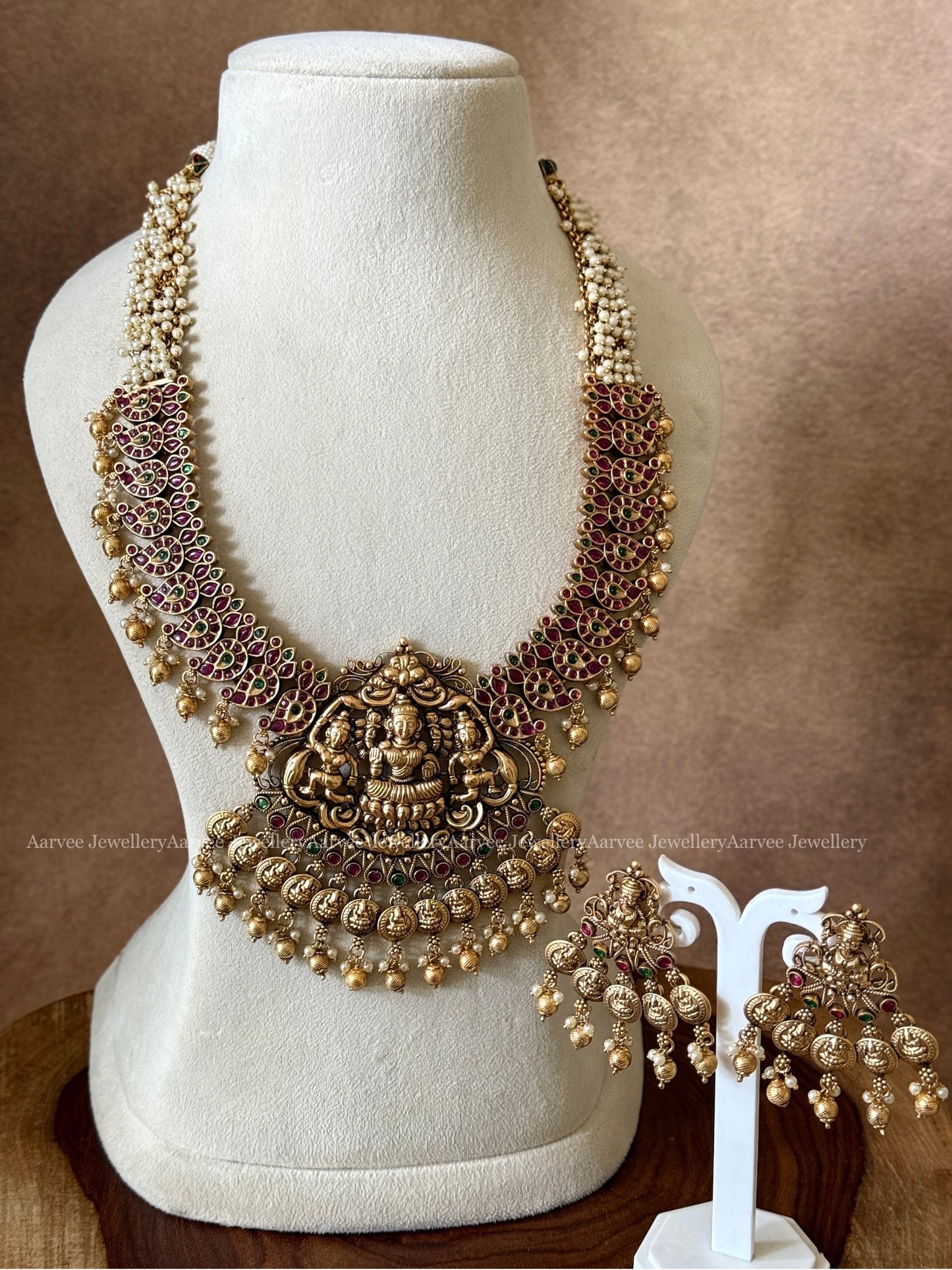 PEARL BUNCH MID LENGTH LAKSHMI PENDANT HARAM SET WITH RUBY / GREEN STONES