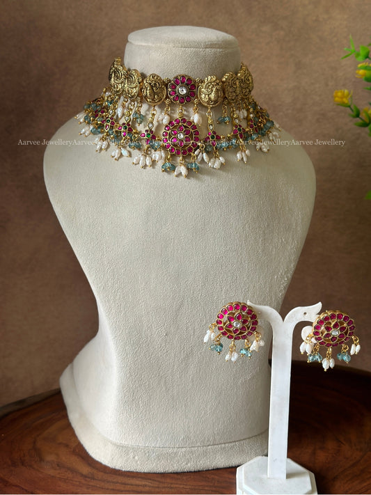 JADAU KUNDAN GOLD TONE PEACOCK MOTIF CHOKER SET WITH TEAL BLUE BEADS & RICE PEARLS