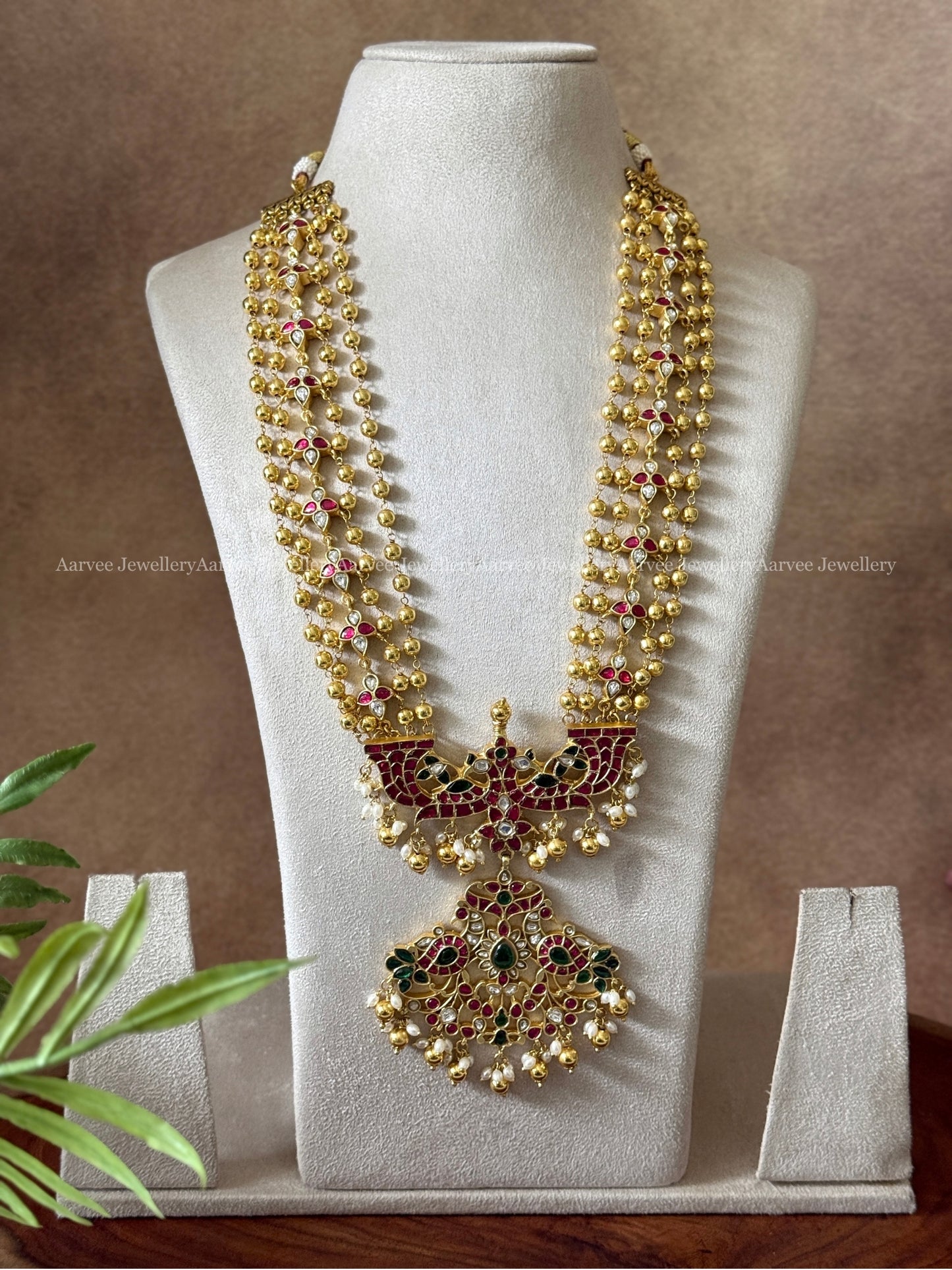 JADAU KUNDAN GOLD BEADED LAYERED MID LENGTH HARAM WITH PEACOCK PENDANT