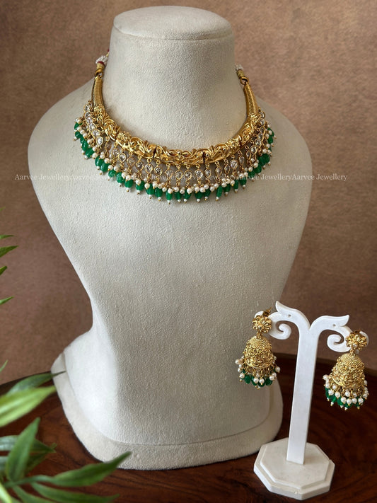 GOLD FINISH KANTI NECKLACE SET WITH GREEN BEADS