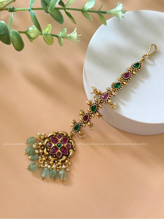 KEMP FLORAL TIKKA WITH RUBY/GREEN STONES AND PASTEL BEADS