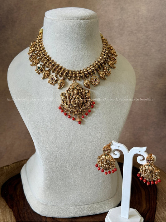GOLD FINISH LAKSHMI NECKLACE SET WITH CORAL BEADS