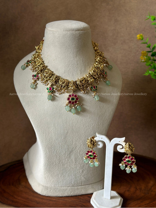 GOLD TONE LAKSHMI NECKLACE SET WITH KEMP STONES AND PASTAL BEADS
