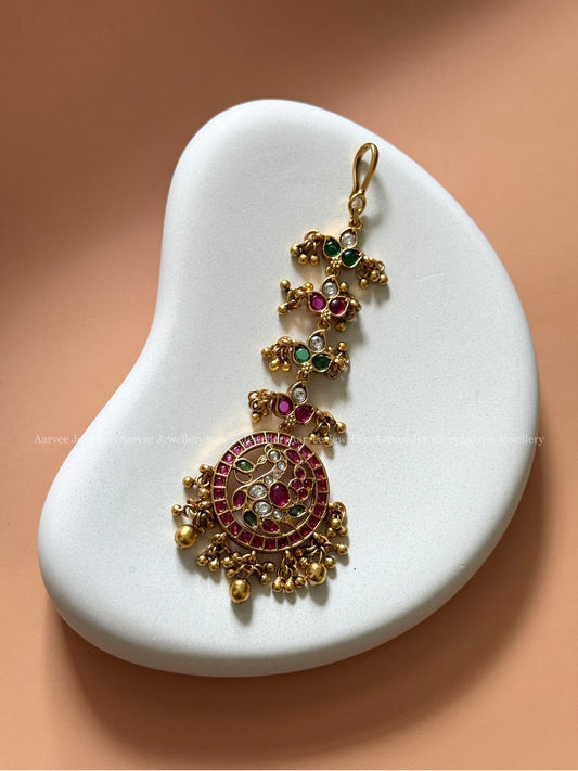 PREMIUM KEMP RUBY / GREEN STONES TIKKA WITH PEACOCK PENDANT - GOLD BEADS