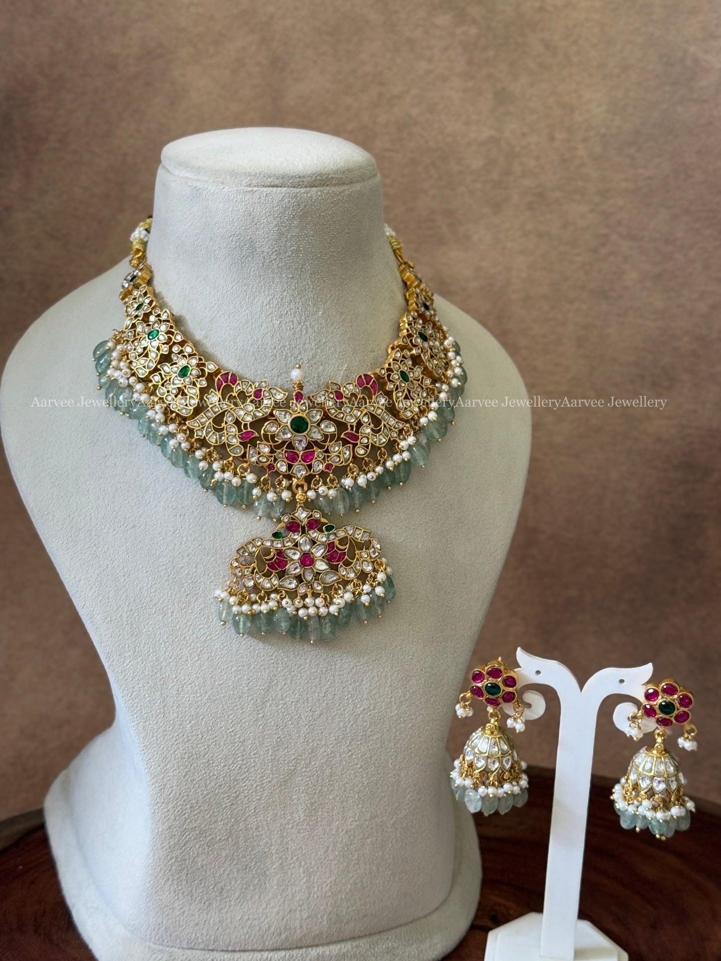 JADAU KUNDAN FLORAL NECKLACE SET WITH PASTEL BLUE BEADS