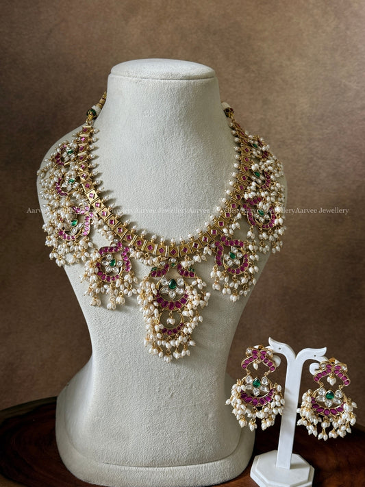 PREMIUM ANTIQUE GOLD FINISH FLORAL GUTTA PUSALU NECKLACE SET WITH RUBY / GREEN KUNDAN STONE & PEARLS