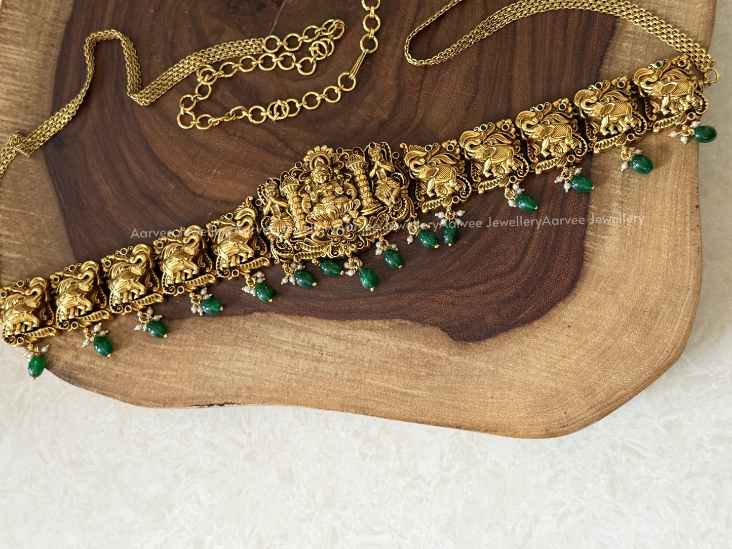 GOLD FINISH LAKSHMI & ELEPHANT MOTIF WAIST CHAIN WITH GREEN BEADS