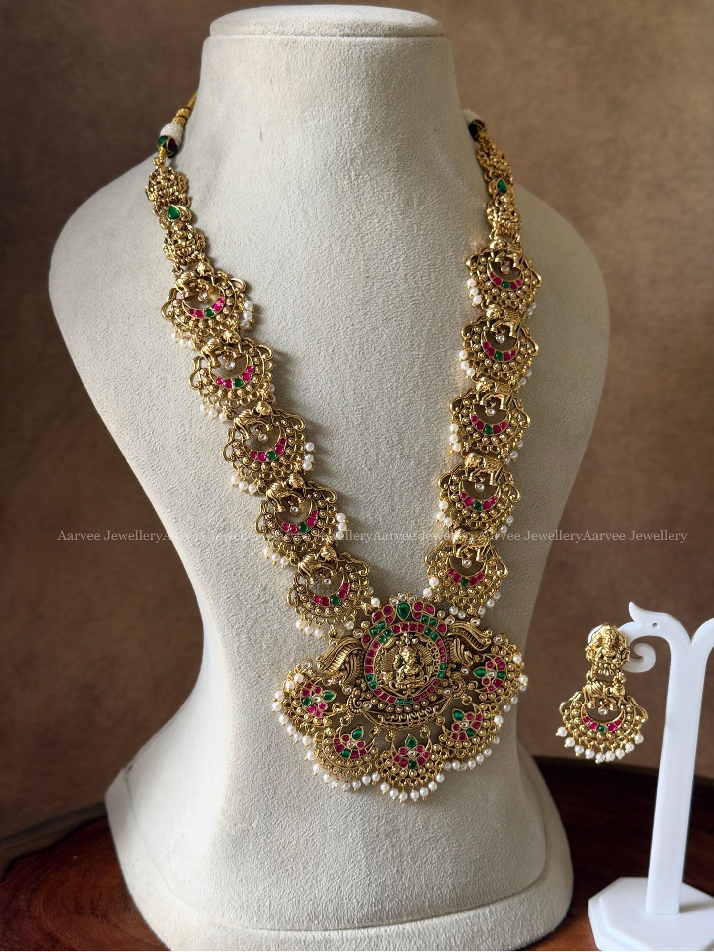FULL GOLD TONE LAKSHMI MOTIF & KUNDAN STONES HARAM SET