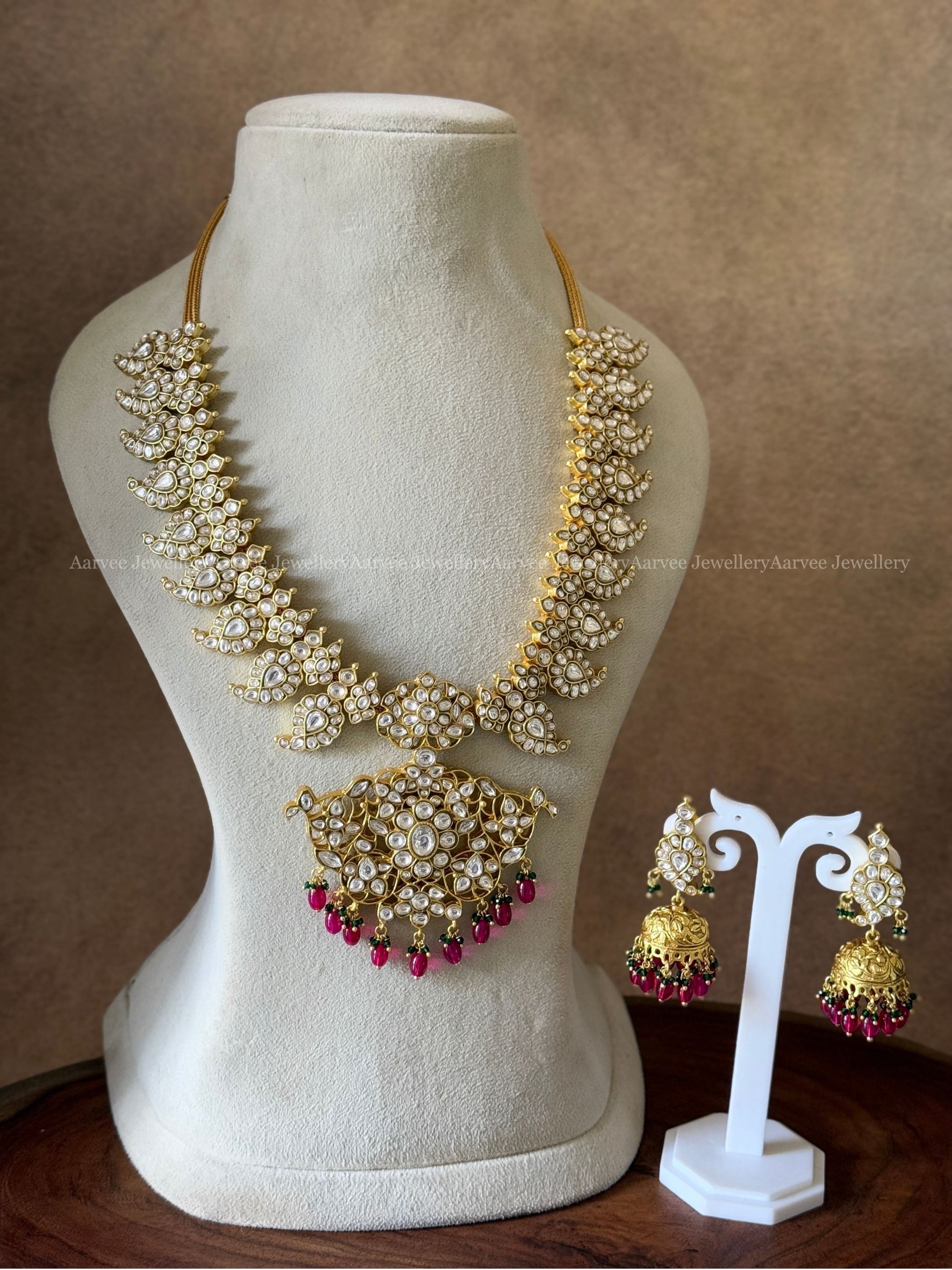 JADAU KUNDAN WHITE STONE MANGO MOTIF MID LENGTH HARAM SET WITH PINK BEADS
