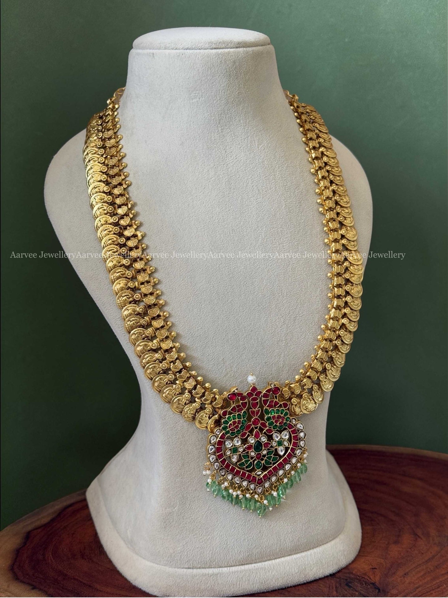 JADAU KUNDAN MID LENGTH GOLD COIN CHAIN WITH PEACOCK PENDANT AND PASTEL BEADS