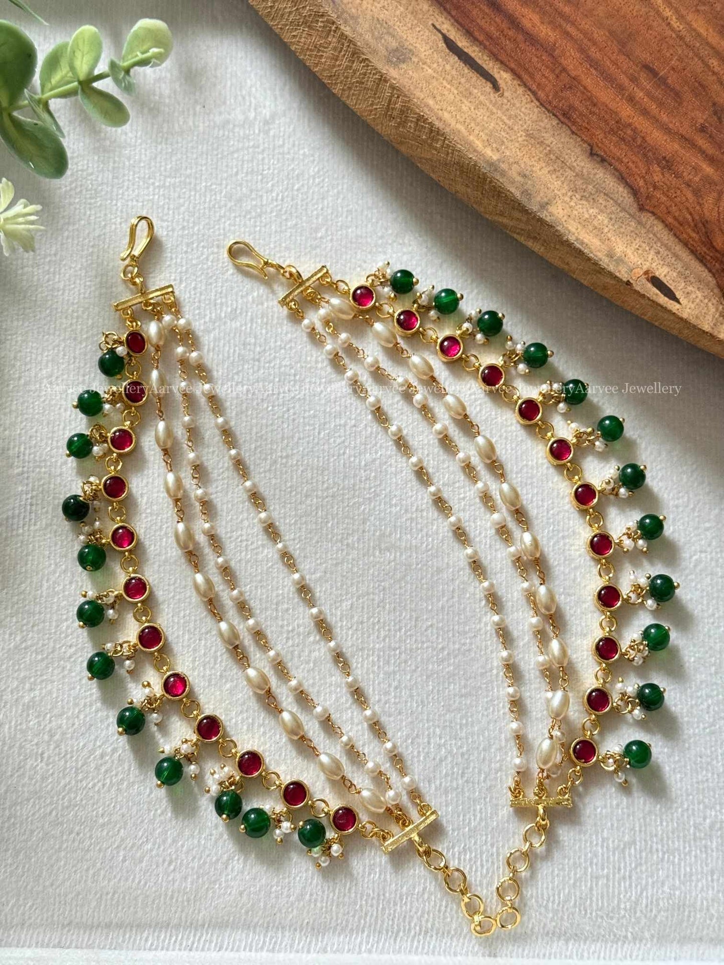 JADAU KUNDAN LAYERED PEARL EAR CHAIN WITH RUBY STONES AND GREEN BEADS